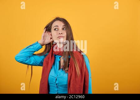 Eavesdropping, espionage, gossip, holding hand near head and looking away Stock Photo
