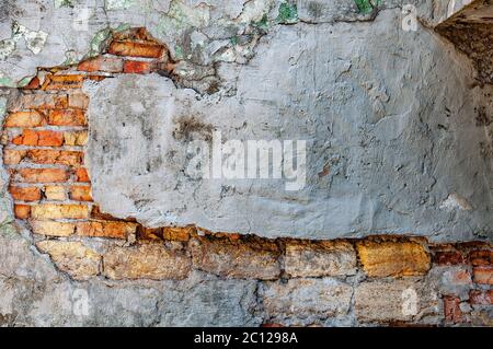 Distressed overlay texture of cracked concrete and brick wall, grunge background. Stock Photo