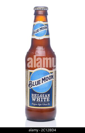 IRVINE, CALIFORNIA - 12 JUNE 2020: A single bottle of Blue Moon Belgian White Wheat Ale with condensation isolated on white with reflection. Stock Photo
