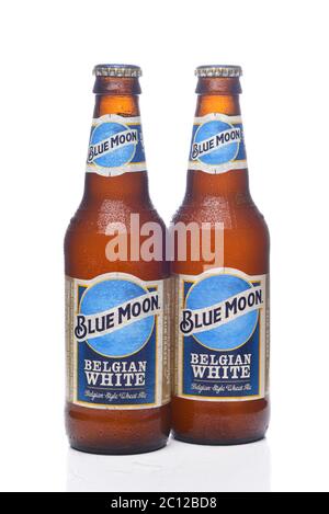 IRVINE, CALIFORNIA - 12 JUNE 2020: Two cold bottles of Blue Moon Belgian White Wheat Ale with condensation isolated on white with reflection. Stock Photo