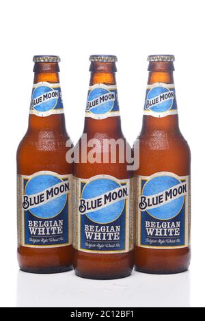 IRVINE, CALIFORNIA - 12 JUNE 2020: Three cold bottles of Blue Moon Belgian White Wheat Ale with condensation isolated on white with reflection. Stock Photo