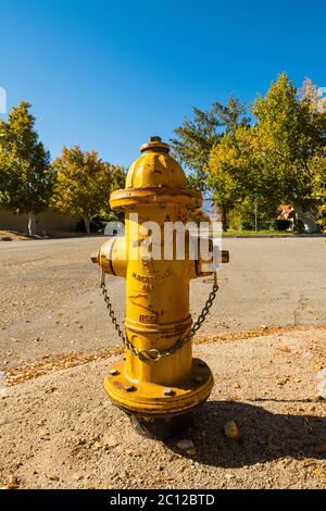 Fire hydrant on a street corner in Independence, California, USA. Stock Photo