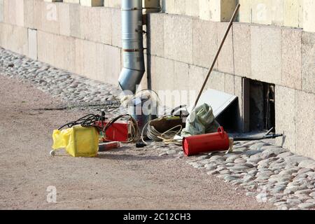 Welder working tools lie on the ground near Gatchina Palace ready to work. Stock Photo