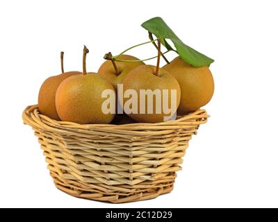 Nashi pears, Pyrus pyrifolia, in basket, isolated against white background Stock Photo