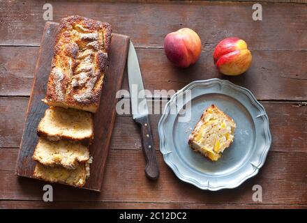 plum and yellow peaches with amaretti baked Stock Photo