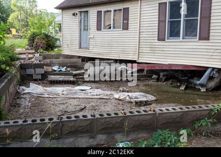 Home, missing foundation, Sanford, MI USA. 6-11-2020, Original dam breech and flooding occurred 5-20-2020, by James D Coppinger/Dembinsky Photo Assoc Stock Photo