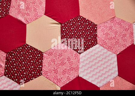 Close up of a colourful traditional hexagonal cloth patchwork pattern. Stock Photo