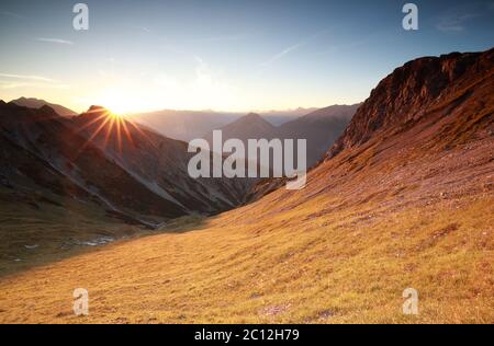 autunm sunrise over mountains in Alps Stock Photo