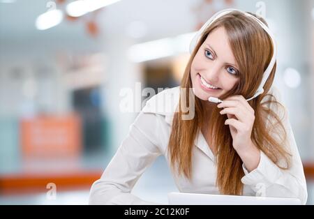 Beautiful Customer Service Representative Using Headset Stock Photo