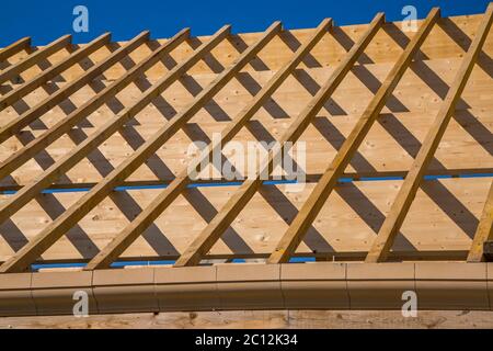 Residential construction home framing against a blue sky Stock Photo