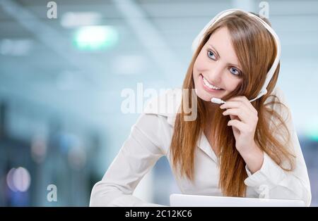 Beautiful Customer Service Representative Using Headset Stock Photo