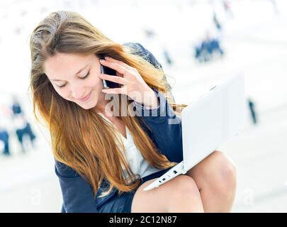 dynamic young executive taking notes on her agenda Stock Photo