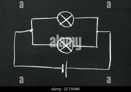 The electrical diagram drawn on a blackboard with chalk Stock Photo