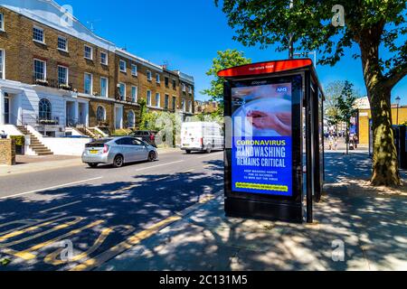 30th May 2020, London, UK - Coronavirus handwashing ad at the bus stop shelter in Chelsea, West London Stock Photo