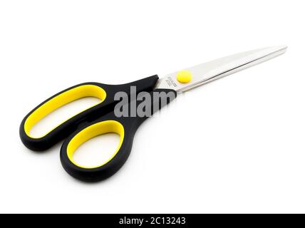 Black Scissors with yellow elements isolated on white background Stock Photo