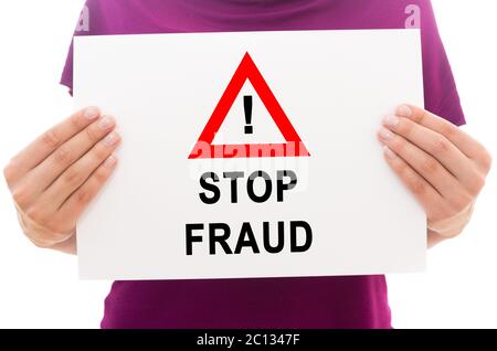 Girl holding white paper sheet with text Stop fraud Stock Photo