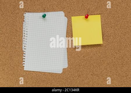 Cork board and note papers, close up image Stock Photo