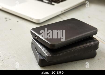 External Hard Disks and Laptop Keyboard Stock Photo