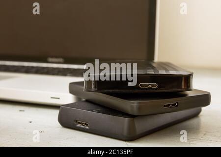 External Hard Disks and Laptop Keyboard Stock Photo