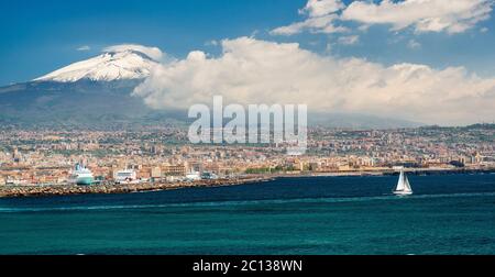 View of Mount Etna, City, and Port, Catania, Sicily, Italy. Catania sits at the foot of Mt. Etna, an active volcano. Stock Photo