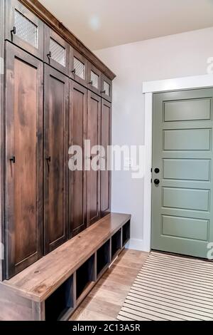 Home interior with fire door adjacent to the tall vintage wooden cabinet Stock Photo