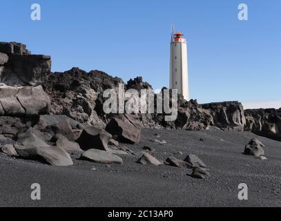 Malarrif Lighthouse above Lava Rocks on Snaefellsnes peninsula in Iceland Stock Photo