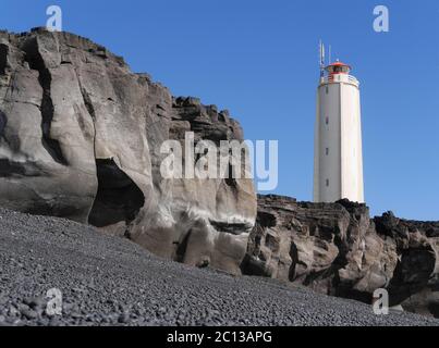 Malarrif Lighthouse above Lava Rocks on Snaefellsnes peninsula in Iceland Stock Photo