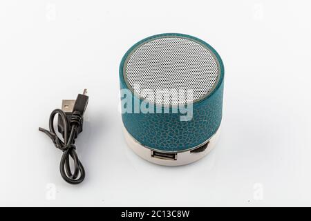 Modern Bluetooth speaker, mini Bluetooth speaker. Mini portable Bluetooth speaker on white backdrop. Stock Photo