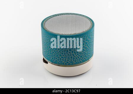 Modern Bluetooth speaker, mini Bluetooth speaker. Mini portable Bluetooth speaker on white backdrop. Stock Photo