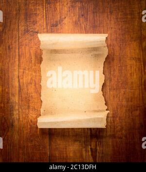 parchment scroll on wooden background Stock Photo