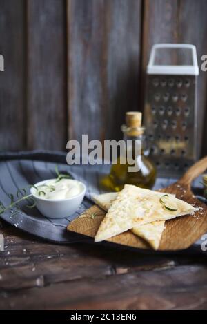 Focaccia with olive oil, cheese, white sause and herbs Stock Photo