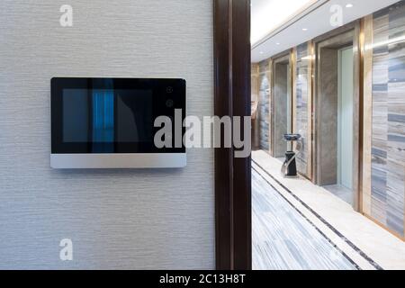 intercom video door bell on the wall outside modern corridor Stock Photo