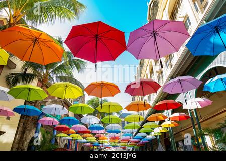 Colorful hanging umbrellas in Caudan waterfront, Mauritius Africa Stock Photo
