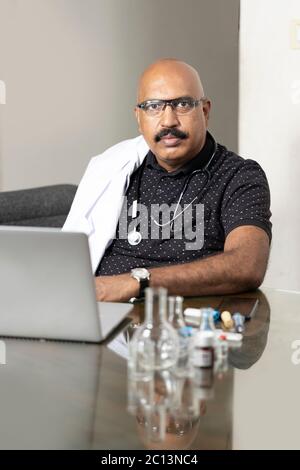 Confident and fit male doctor posing for the camera stock photo Stock Photo