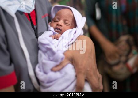 DHAKA, BANGLADESH 16th August : Suraiya infant who was took bullet in mother’s womb shifted to her mother at Dhaka Medical College Hospital, Banglades Stock Photo