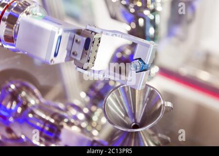 Robot mechanical arm with chemical tubes in a medical laboratory Stock Photo