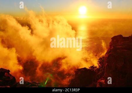 Magic Sunset in the clouds over the ocean Stock Photo