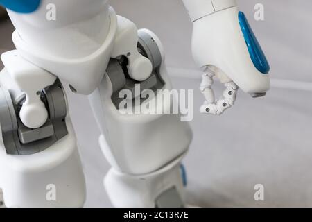 Small robot with human face and body. Hand and legs. Stock Photo