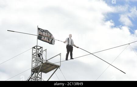 June 13, 2020 - Sarasota, Florida, United States - High wire artist Nik Wallenda performs at Nik Wallenda's Daredevil Rally, billed as the world's first drive-in stunt show, on June 13, 2020 in Sarasota, Florida. The show, which runs on select dates through June 21, features internationally known daredevil performers and is designed to be a safe event during the coronavirus pandemic, with the separation of spectator's vehicles according to social distancing guidelines. (Paul Hennessy/Alamy) Stock Photo