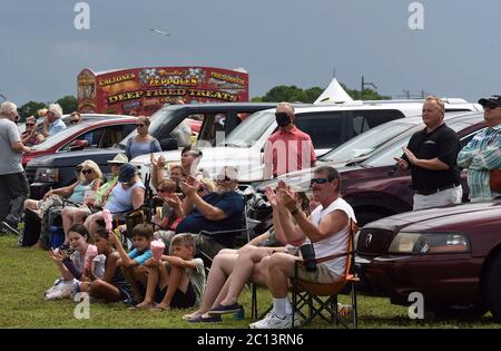 June 13, 2020 - Sarasota, Florida, United States - Spectators react at Nik Wallenda's Daredevil Rally, billed as the world's first drive-in stunt show, on June 13, 2020 in Sarasota, Florida. The show, which runs on select dates through June 21, features internationally known daredevil performers and is designed to be a safe event during the coronavirus pandemic, with the separation of spectator's vehicles according to social distancing guidelines. (Paul Hennessy/Alamy) Stock Photo