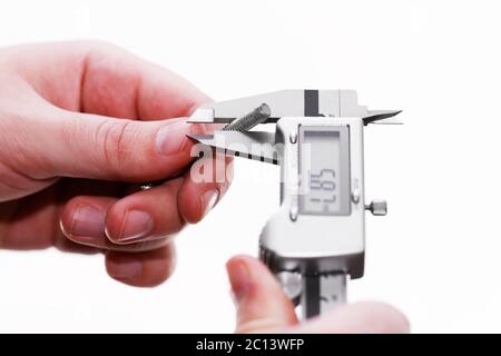 Digital Caliper in a man hand isolated on white background Stock Photo