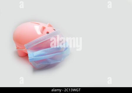 image showing a piggy bank wearing a mask Stock Photo
