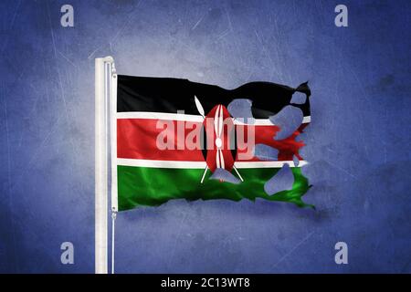 Torn flag of Kenya flying against grunge background Stock Photo