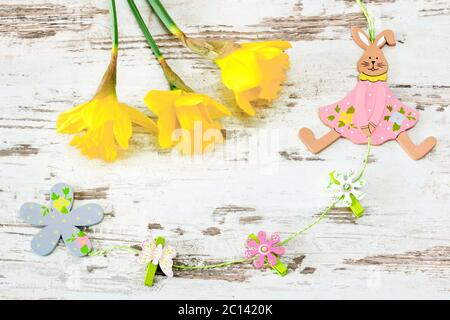 easter bunny of wood with jonquil Stock Photo
