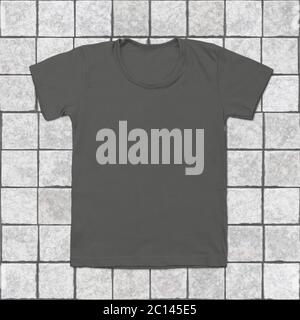 Grey blank t-shirt on tile background Stock Photo
