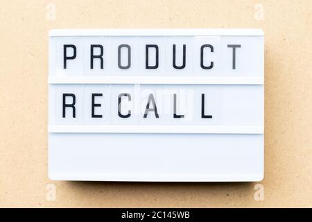 White lightbox with word product recall on wood background Stock Photo