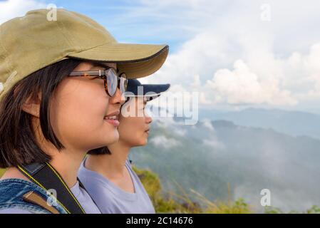 Face two young women watching nature Stock Photo