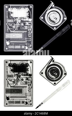 X-ray of a Calculator, a Self-retracting metal tape measure and a Ballpoint pen. View inside these devices. Isolated on white and black Stock Photo