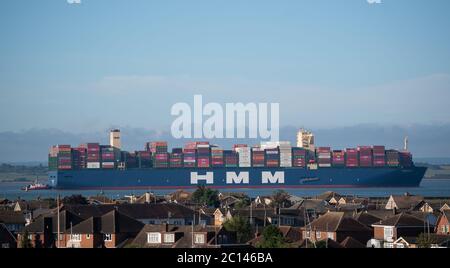 HMM Algeciras, the world's largest container ship, passes Canvey Island in Essex as it arrives in the UK for the first time. Stock Photo