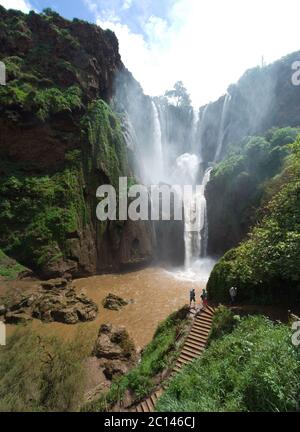 People watching the gigantic Ouzoud Waterfalls in the Grand Atlas mountains near Marrakesh, Tanaghmeilt, Morocco Stock Photo